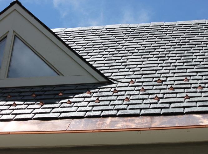 Slate roof fitted with snow retention guards
